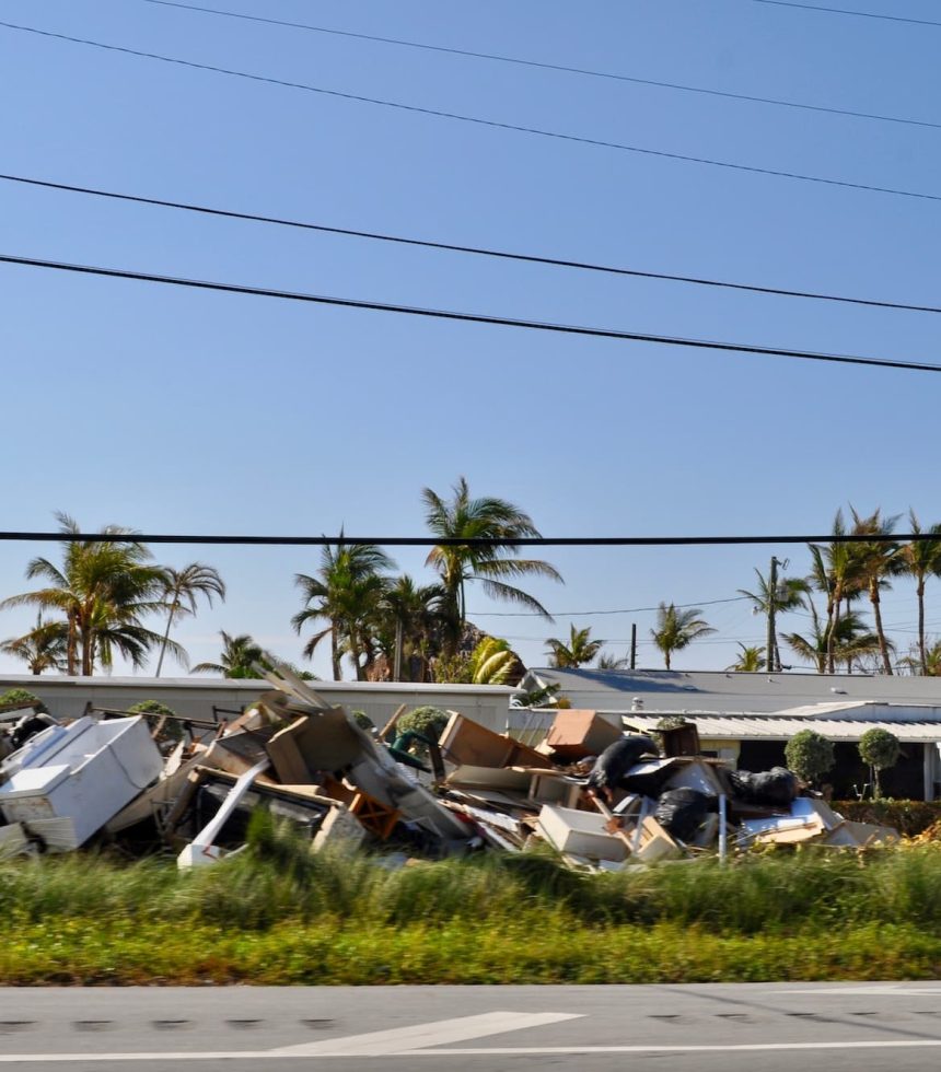 Piles of damaged property along the side of the highway after hurricane Irma.