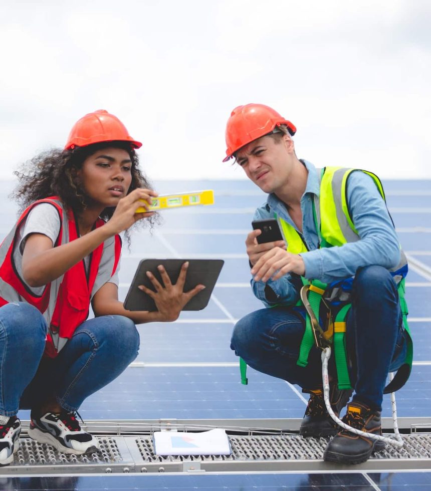 Specialist technician professional engineer checking top view of installing factory solar roof panel