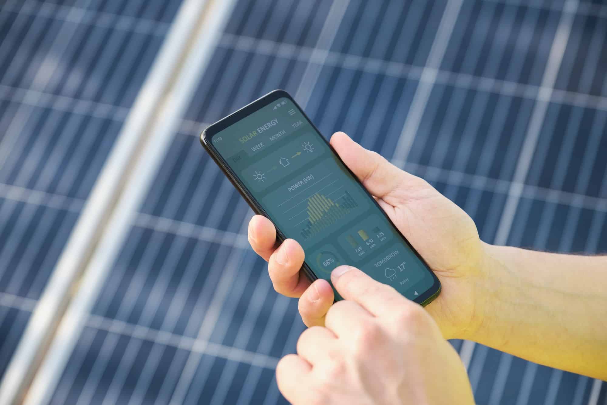 hands-checking-solar-power-generation-in-a-smartphone-app-.jpg